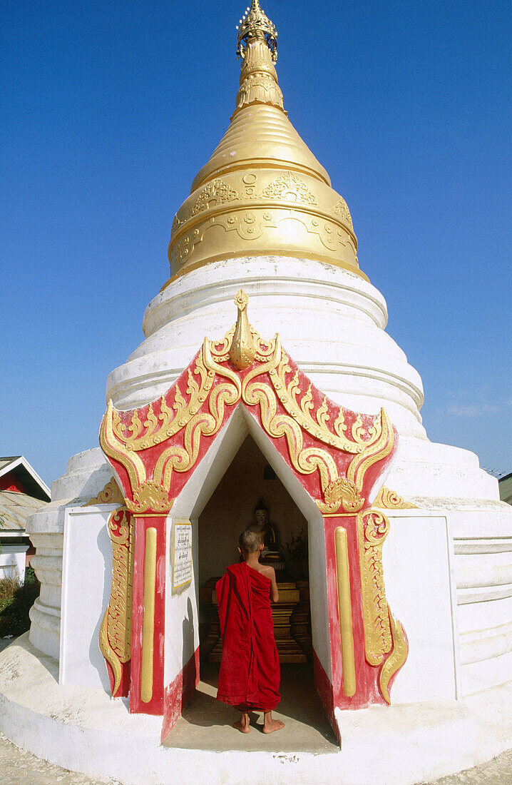 Novice monk in buddhist pagoda. Mandalay. Myanmar (Burma).