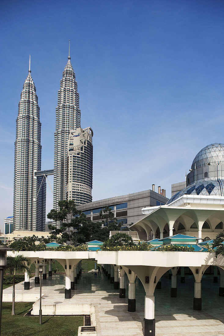 Malaysia. Kuala Lumpur. Petronas Towers and Al-Asykin Mosque.