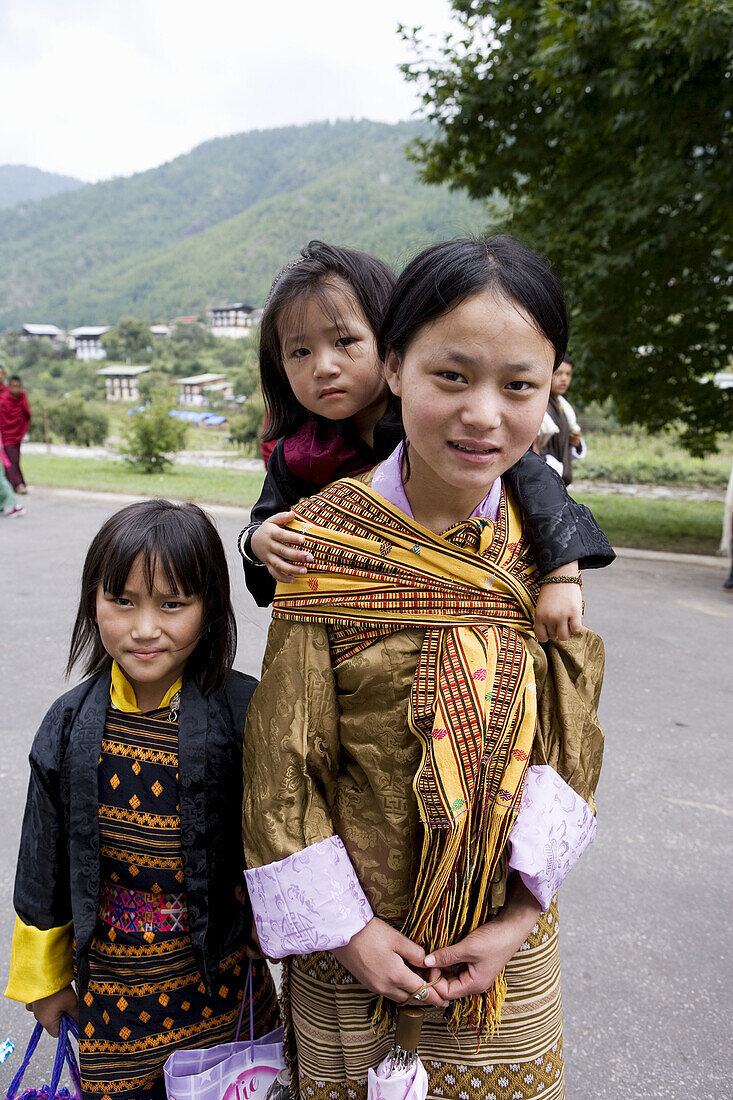 Young girl with sisters. Thimphu. Bhutan