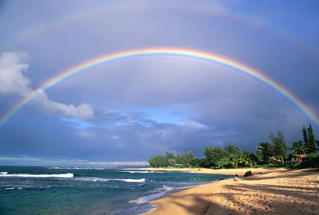 Double rainbow and evening light on Tunnels Beach, North Shore, Island of Kauai, Hawaii