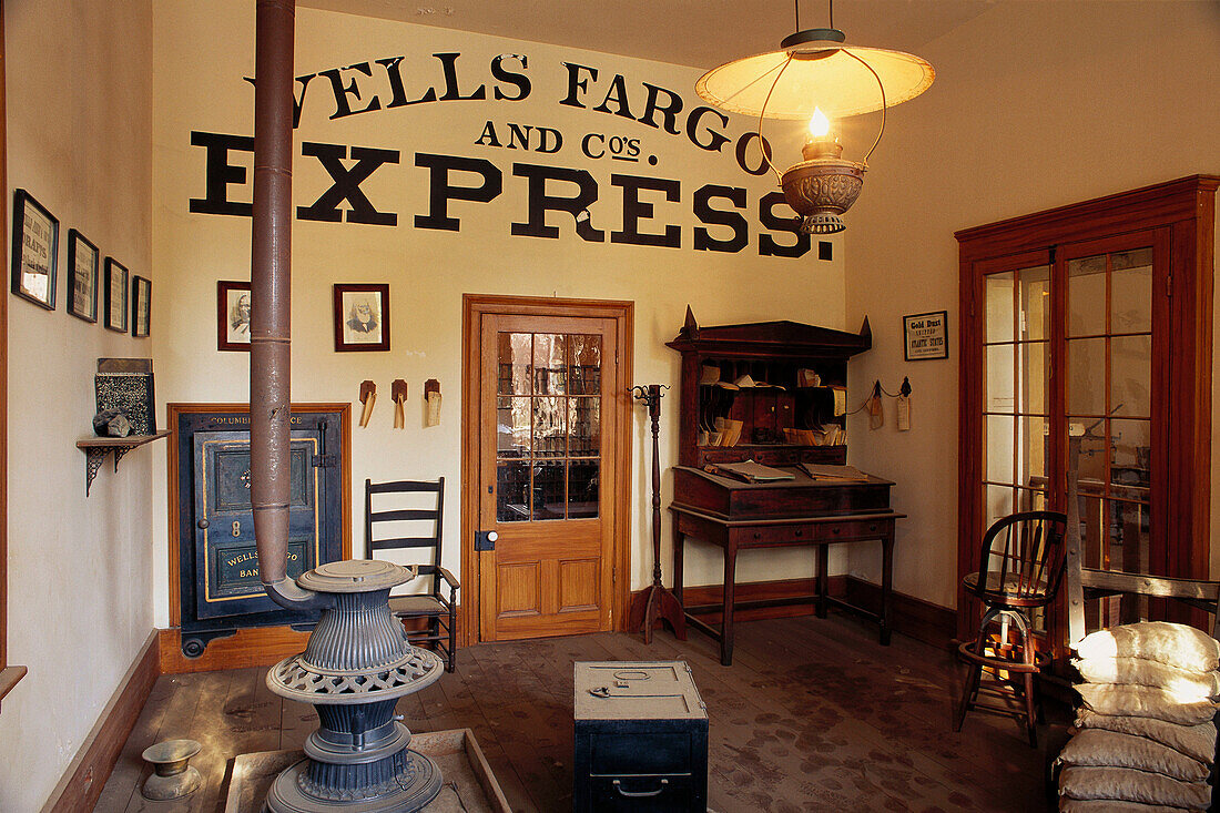 Wood stove and bank vault in the Wells Fargo and Co. Express office in Columbia. California. USA