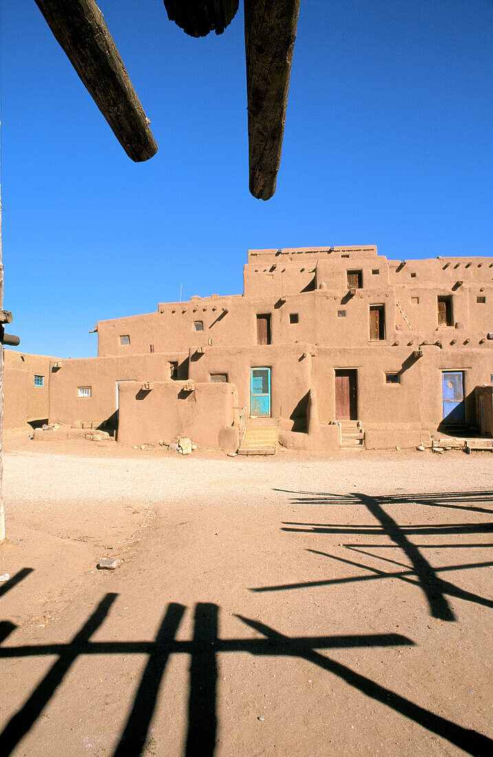 Morning light on the 3-story adobe North House (World Heritage Site), Taos Pueblo, New Mexico, USA