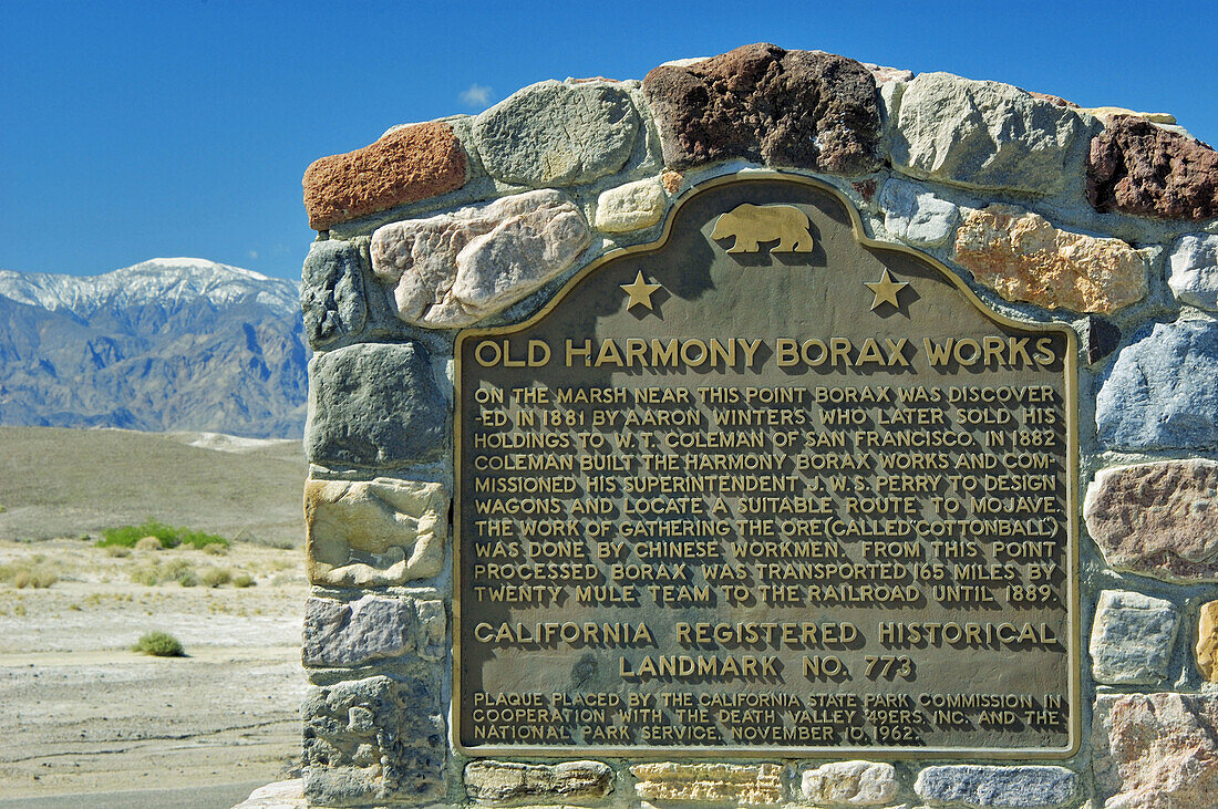 California historical landmark plaque under snow covered peak at Harmony Borax Works, Death Valley National Park, California