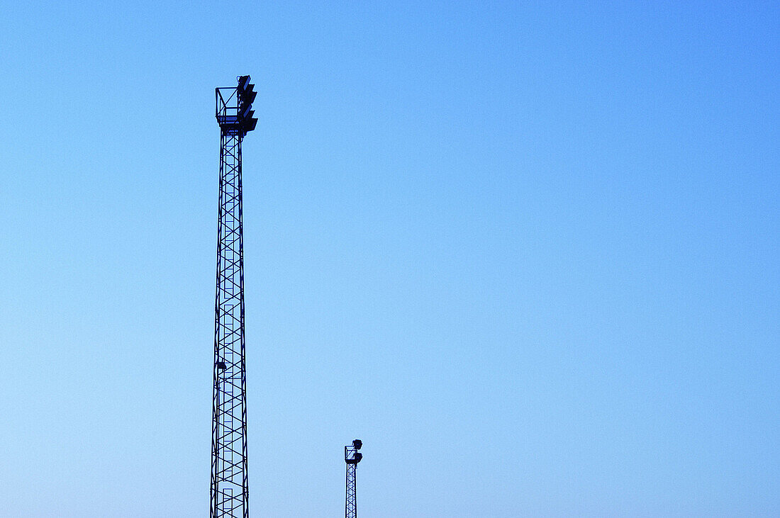  Blue, Blue sky, Color, Colour, Concept, Concepts, Daytime, Engineering, Exterior, Height, Horizontal, Industrial, Industry, Outdoor, Outdoors, Outside, Pair, Platform, Platforms, Silhouette, Silhouettes, Skies, Sky, Surveillance, Tall, Tower, Towers, Two