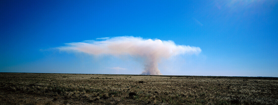 Smoke clouds rising from wild grass fire, Australia