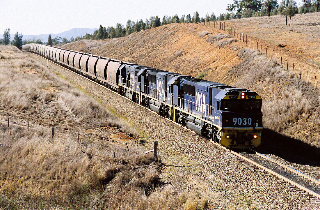 Transportation, empty coal train returning to mine. Energy fossil fuel, greenhouse gases.