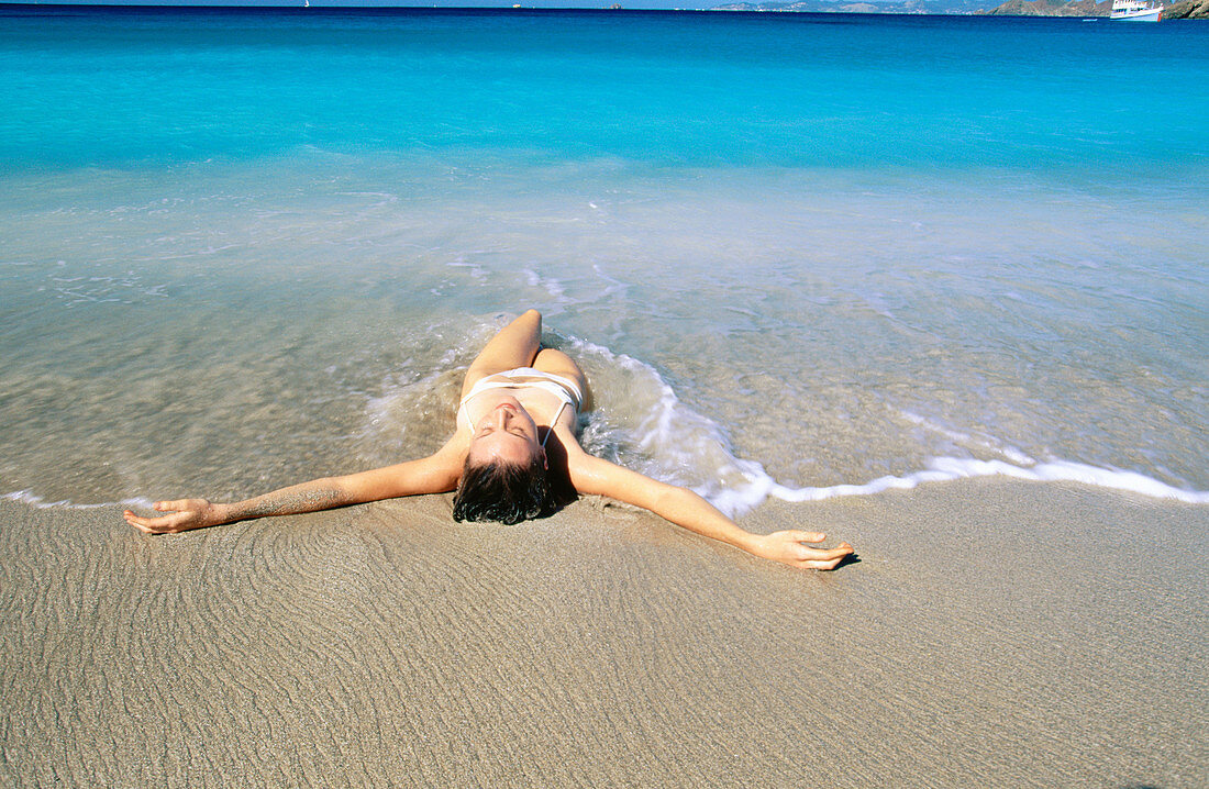 Saint Barthelemy, Caribbean, woman on beach at Colombier Bay