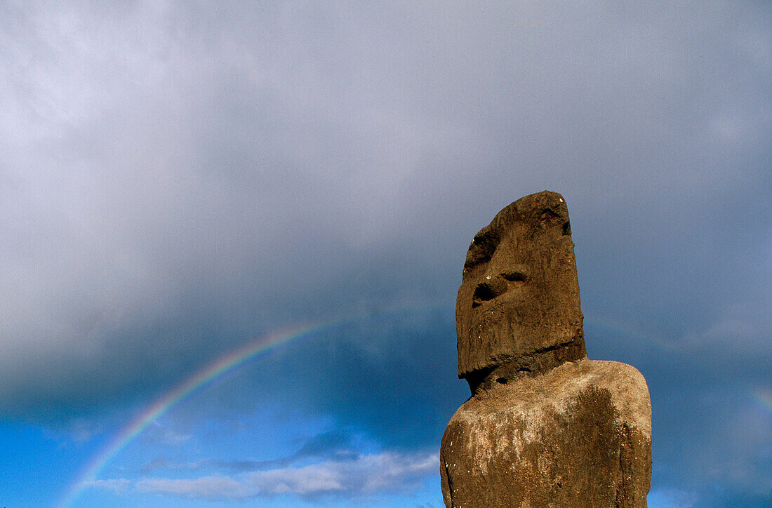 Moai under a rainbow. Easter Island. Chile