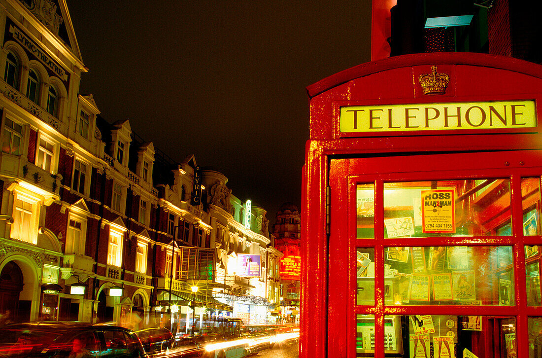 Telephone booth at night. London. England