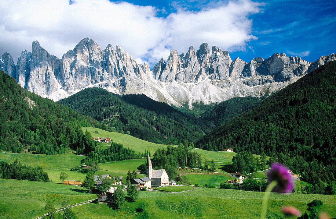 Village of Santa Magdalena in in the Odles Mountains (Val di Funes). Dolomites at the background. Alps. Italy