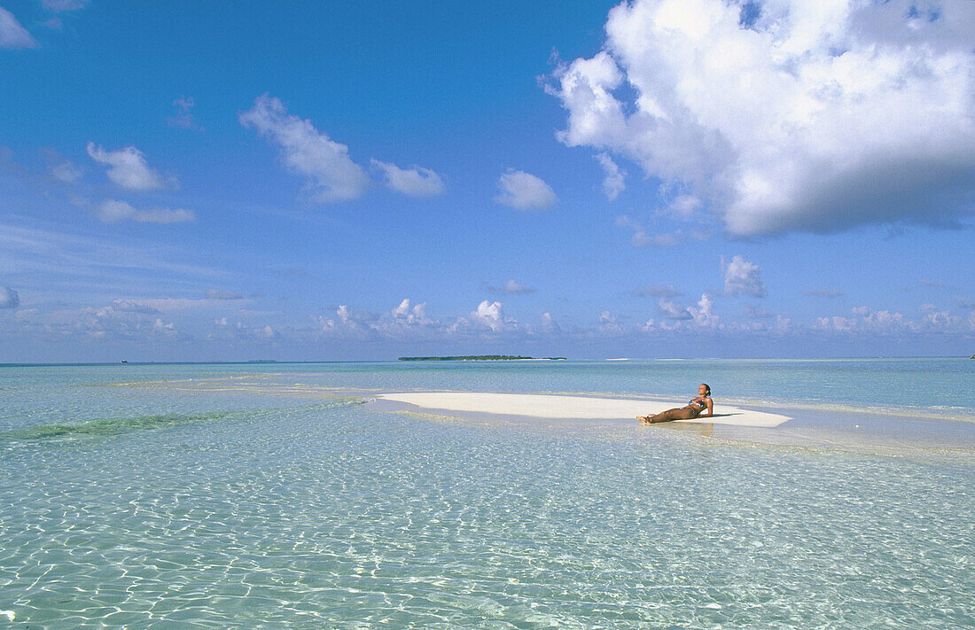 Woman on the beach in White Sands Resort and Spa. Ari Atoll. Maldives