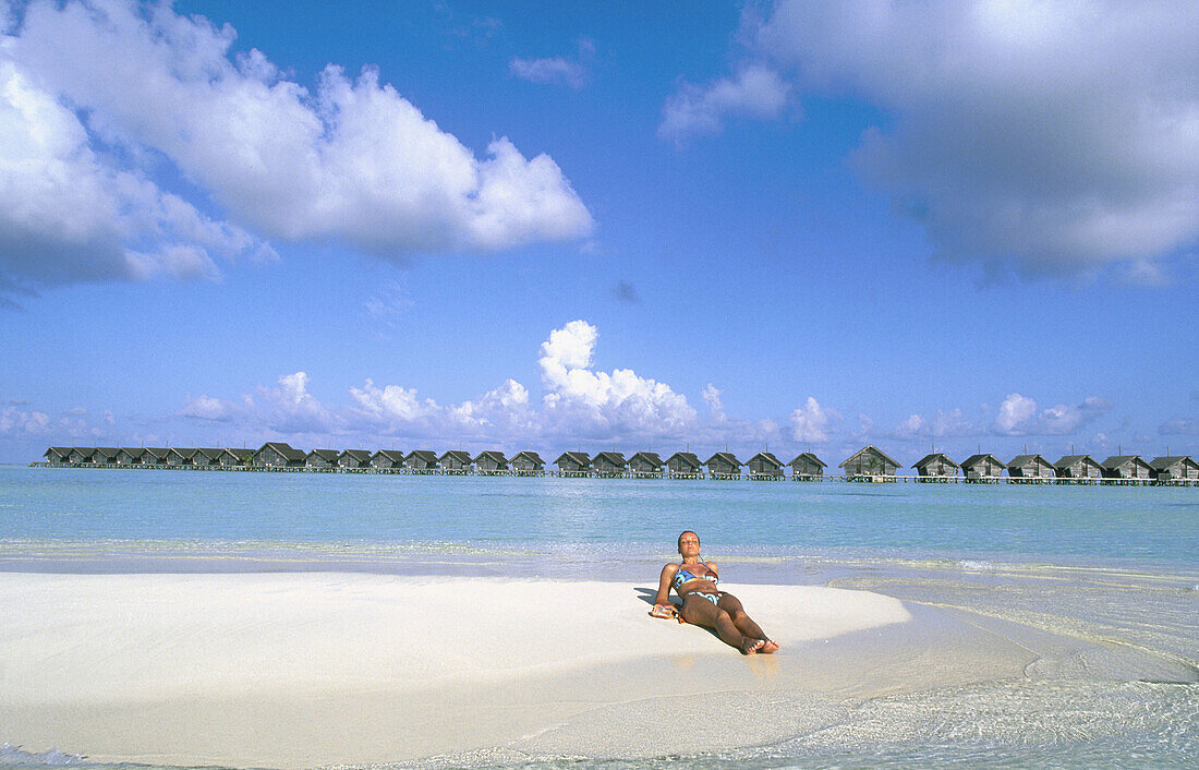 Woman on the beach in White Sands Resort and Spa. Ari Atoll. Maldives