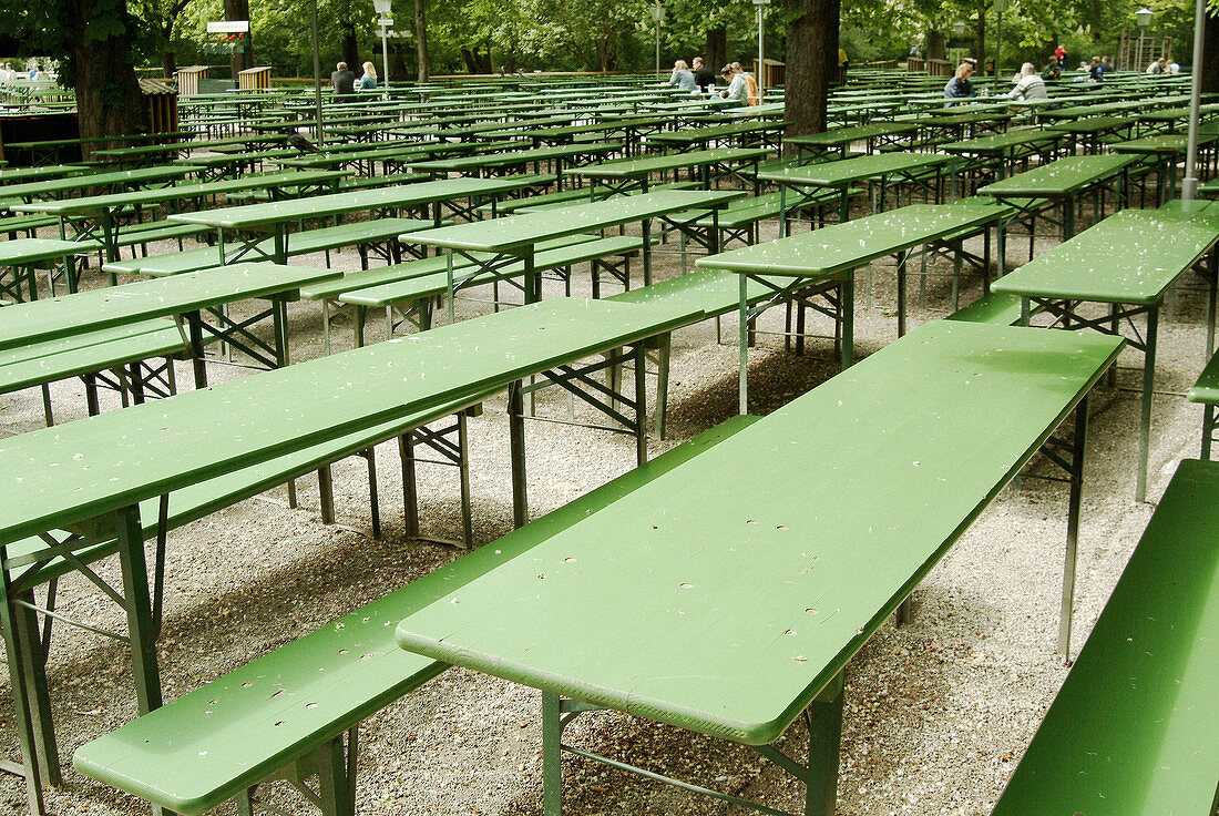 Empty tables in the beergarden near the Chinese Tower. English Gardens. Munich. Bavaria. Germany