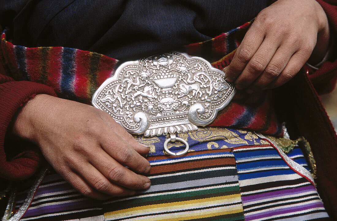 Traditional woman s Chuba dress, silver clasp holds apron. Kangchenjunga. East Nepal