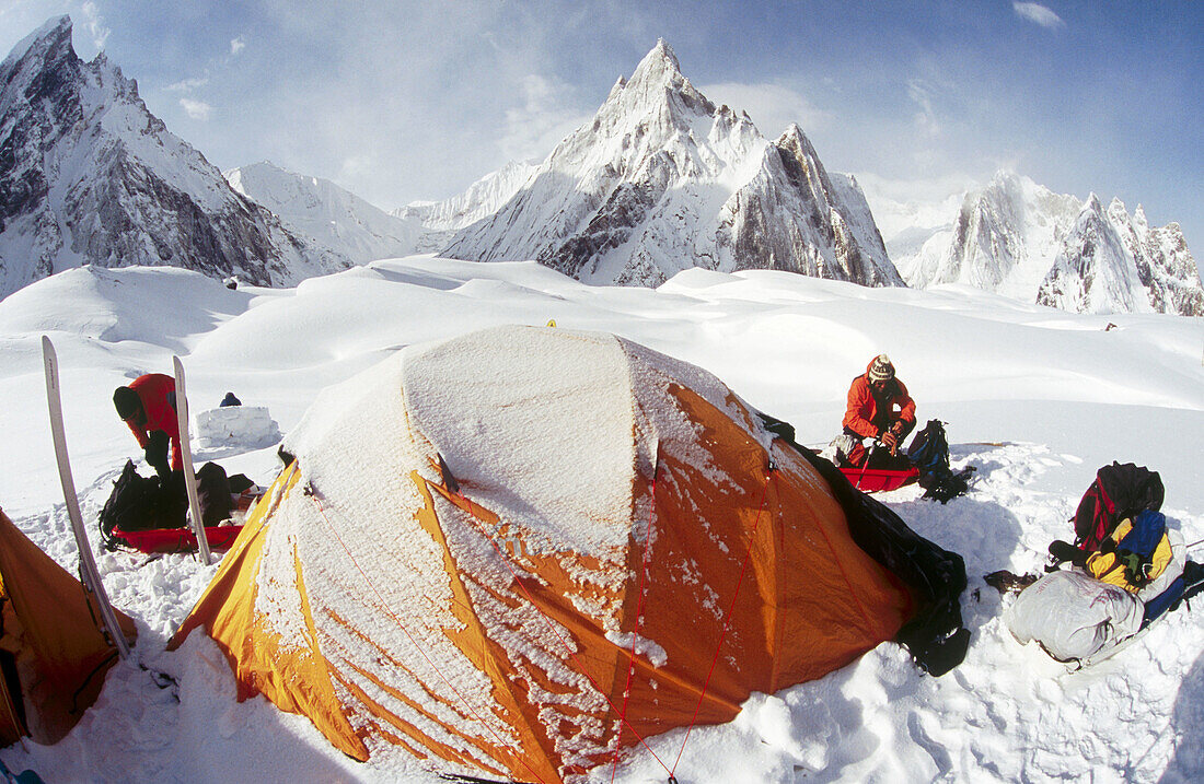 Concordia campsite, sorting gear after storm. Karakoram mountains, Pakistan