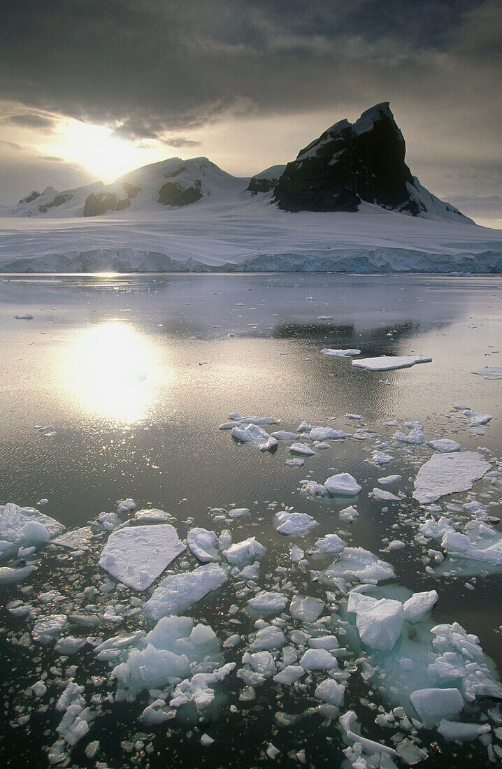 Iceberg and storm clouds. Gerlache Strait. Antarctic Peninsula. Antarctica.