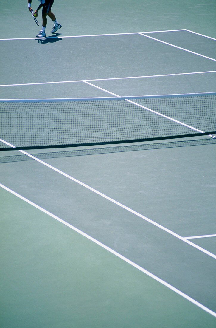 Tennis player legs on tennis court