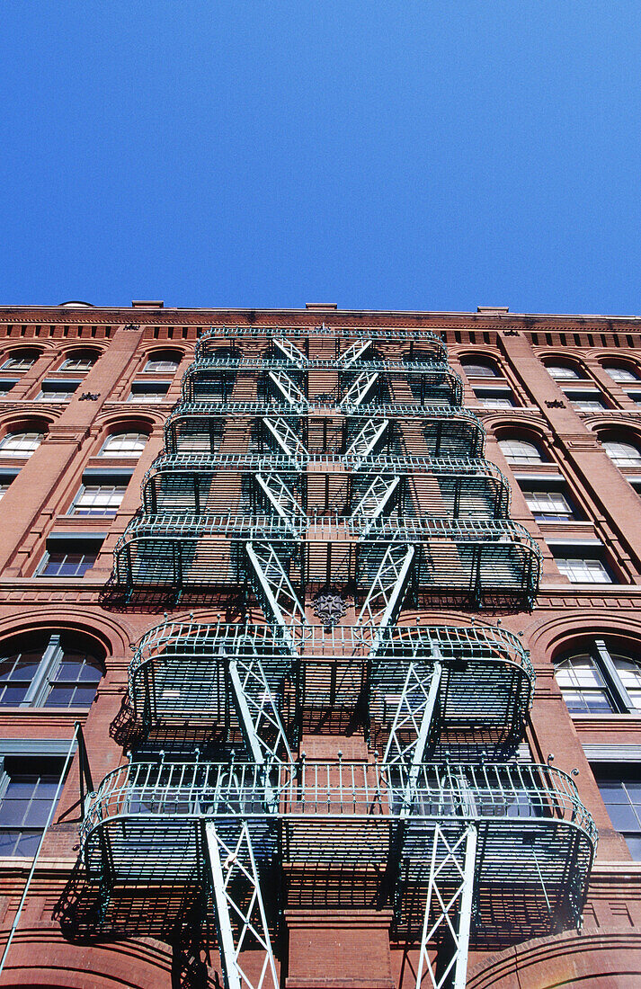Building with fire escape staircase. New York City. USA