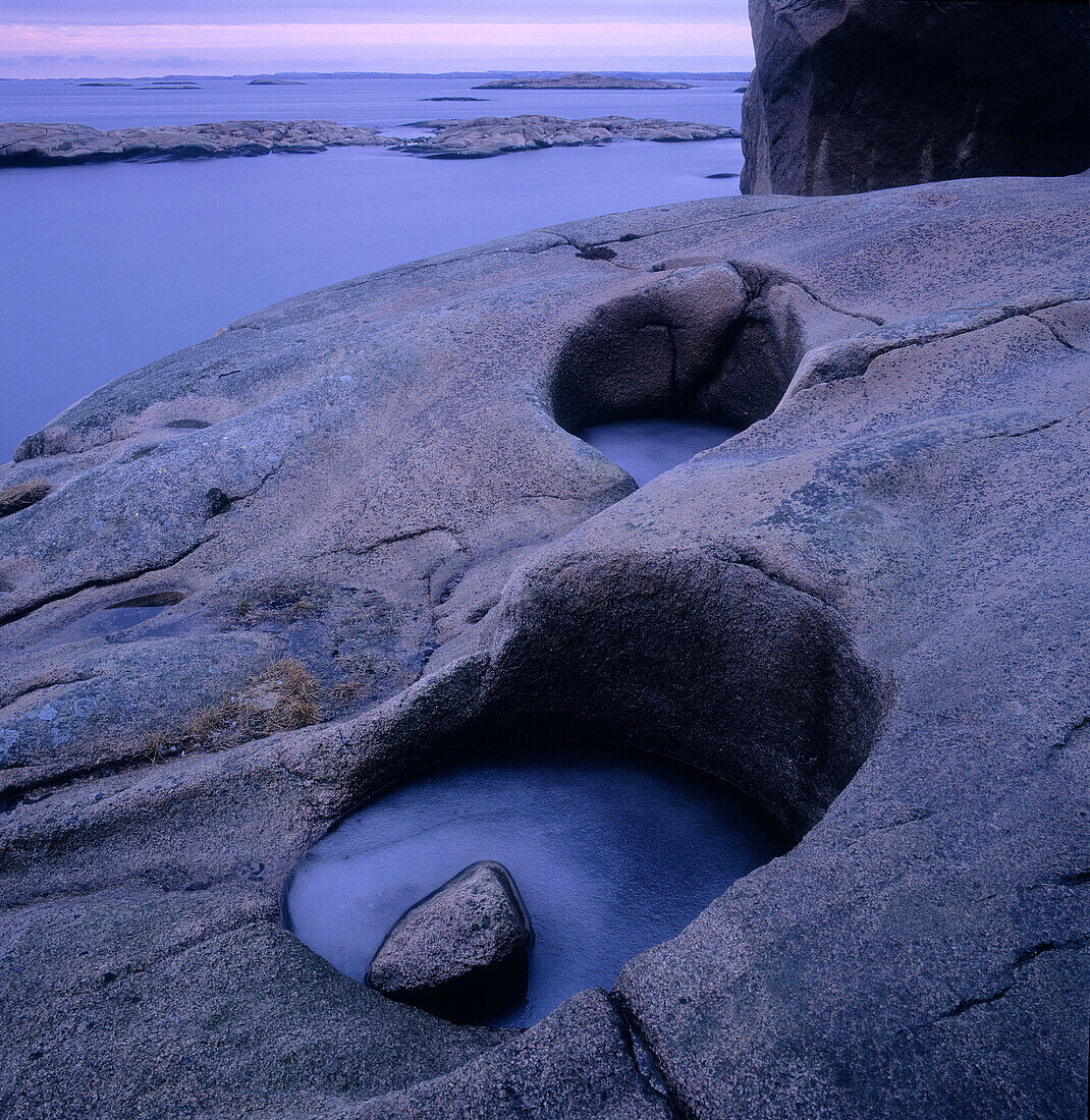 Cliffs with eroded holes from wind and ice. The Bohus Archipelago. Sweden.