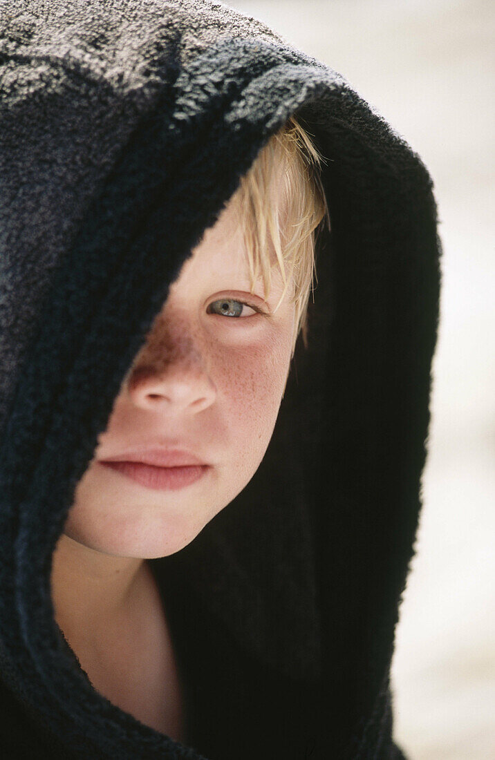 Boy in black bathrobe