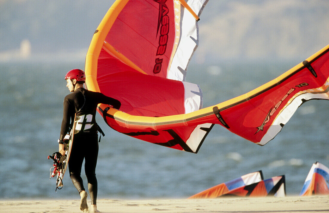 Kite surfers or kite sailors.