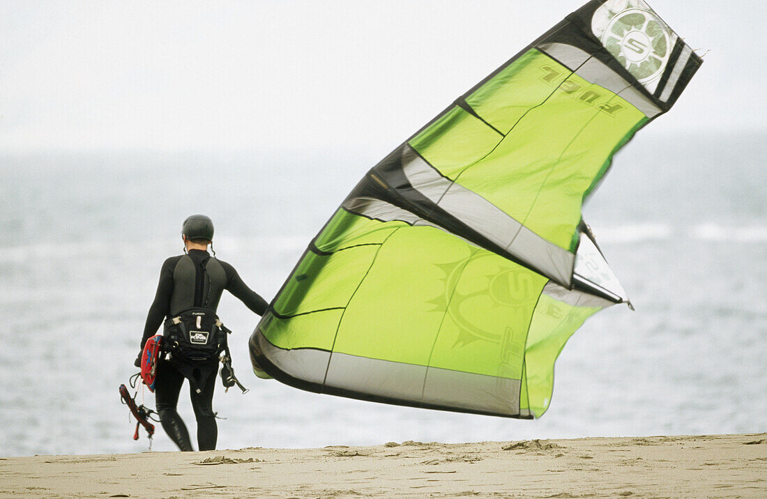 Kite surfers or kite sailors.