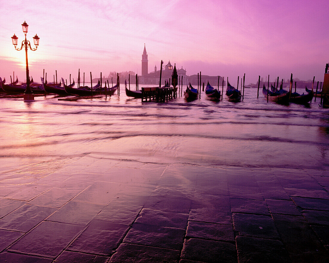 Gondolas and San Giorgio Maggiore island in background. Venice. Italy