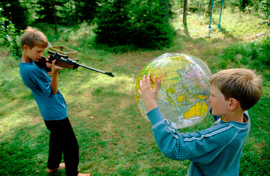 m, Arms, Caucasian, Caucasians, Child, Children, Children only, Color, Colour, Contemporary, Daytime, Exterior, Facial expression, Facial expressions, Fun, Globe, Globes, Horizontal, Human, Kid, Kids