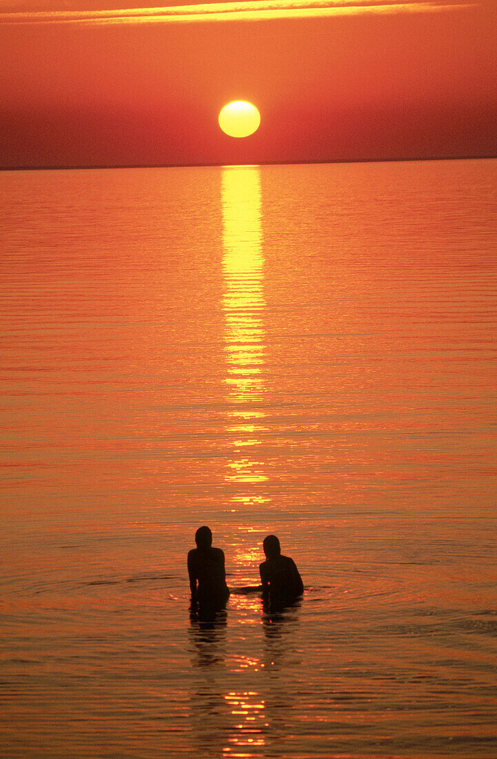 Bathing in the sea at sunset. Öland. Sweden