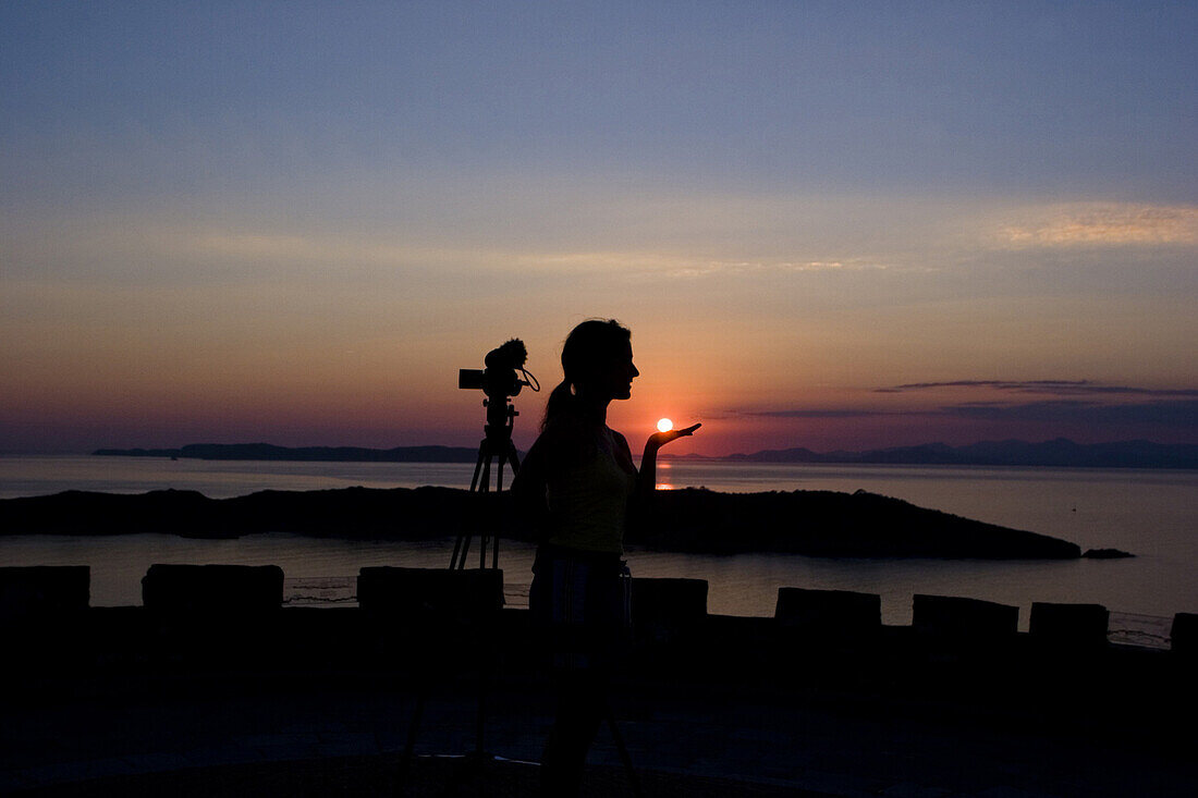 Young woman at a fort at sunset, Port Cros, France, Europe