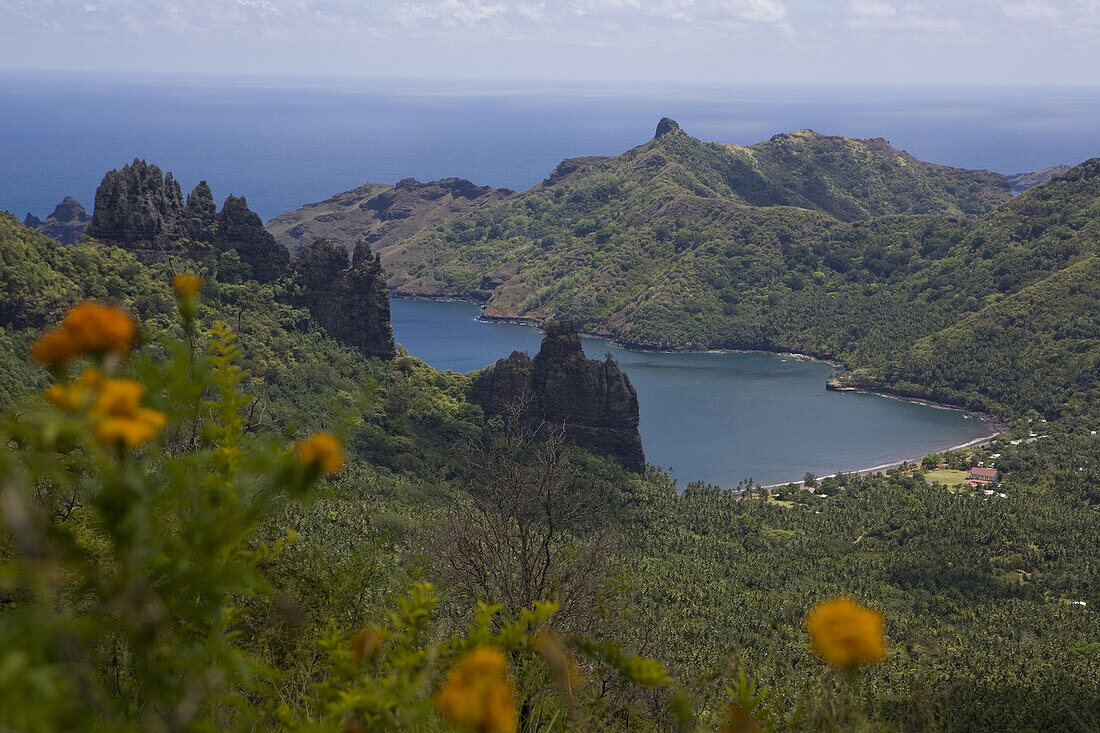 High angle view at mountain peaks and bay, Hatiheu, Nuku Hiva, Marquesas, Polynesia, Oceania