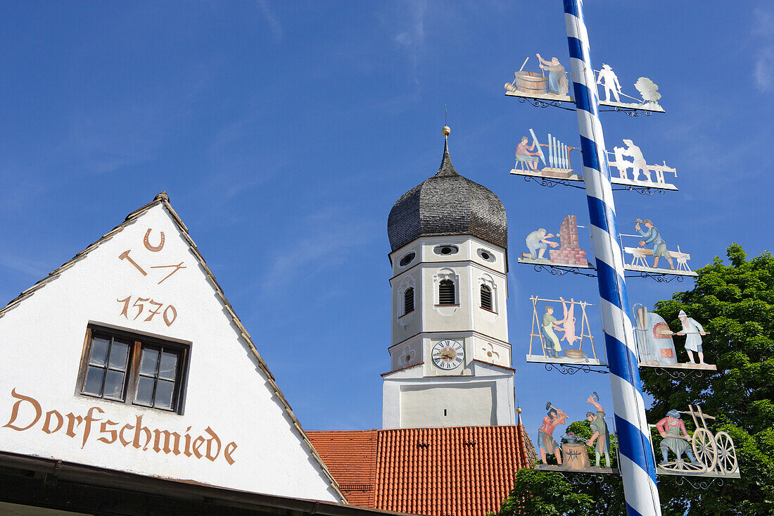 Maypole and church of Andechs, district of Starnberg, Bavaria, Germany