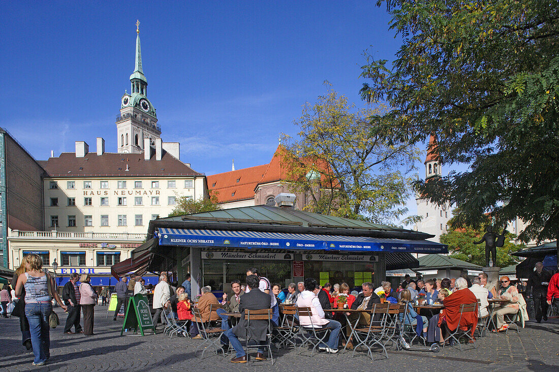 People at Viktualienmarkt in front of the tower of Alter Peter, Munich, Bavaria, Germany