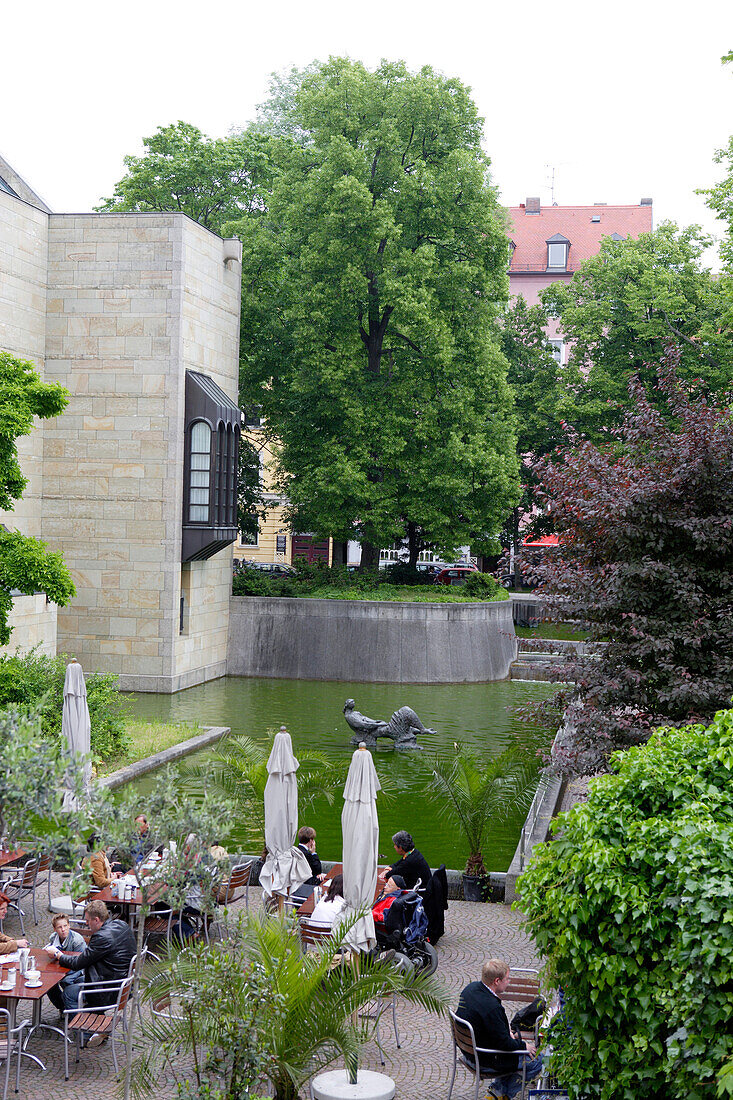 People sitting on terrace of Cafe Greco at the museum Neue Pinakothek, Munich, Bavaria, Germany