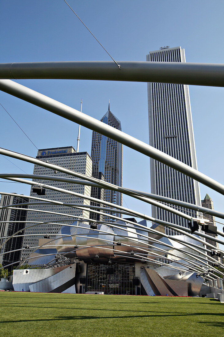 Illinois. Chicago. Pritzker Pavilion and Great Lawn in Millennium Park, Frank Gehry architect of modern design, empty grassy area