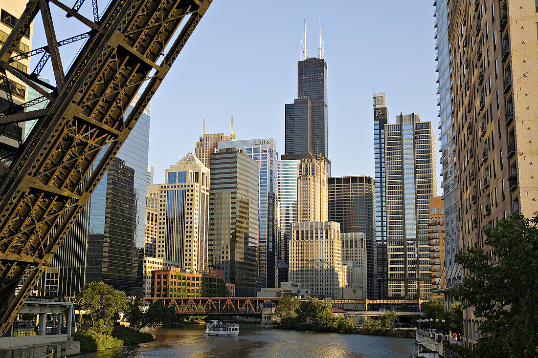 Illinois. Chicago. Chicago River in downtown loop area of city, permanently upraised bridge over river, old railroad bridge, tour boat