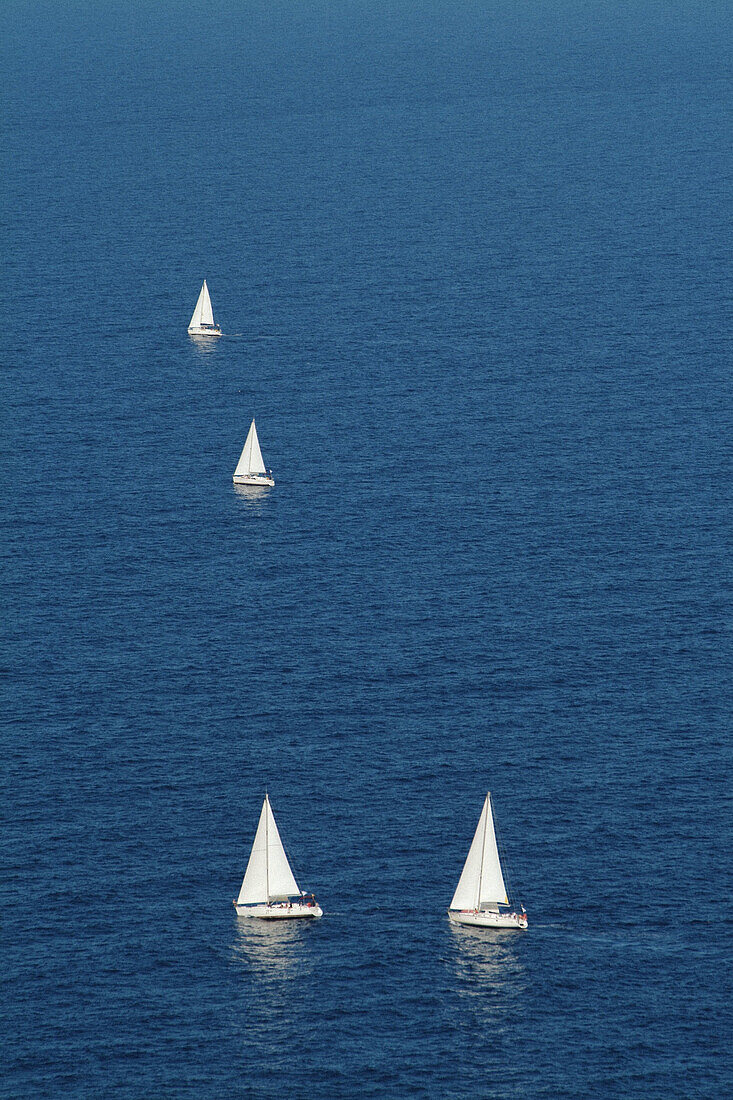Sailboats from Tramuntana mountain range. Mallorca. Balearic Islands. Spain