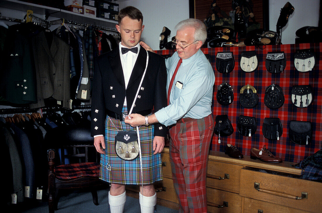 Tailor taking measurements for a jacket, traditional dress, Inverness Highlands, Scotland, Great Britain
