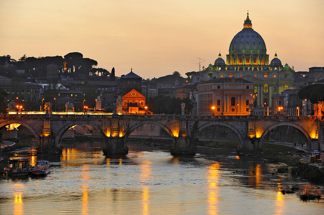 Ponte Sant'Angelo at dusk, with St. Peter's Basilica in the background, Rome, Italy