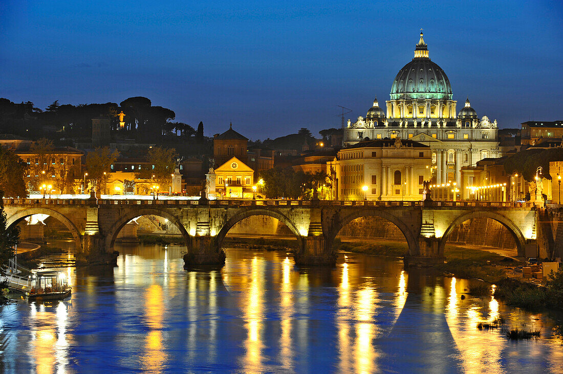 Ponte Sant'Angelo at dusk, with St. Peter's Basilica in the background, Rome, Italy