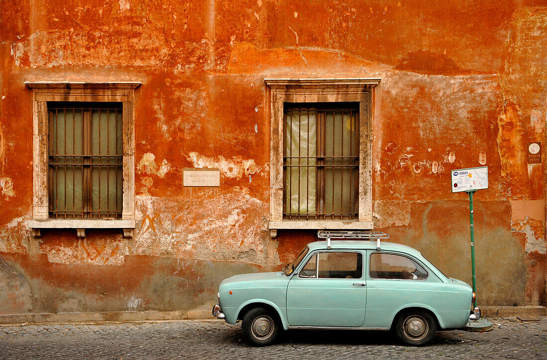 Wall of house with a Fiat 850 in front, Trastevere, Rome, Italy