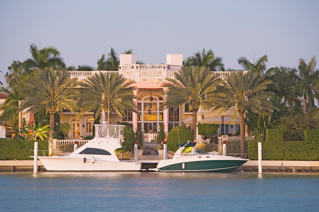 Motorboats in front of villa at Palm Island, Miami, Florida, USA