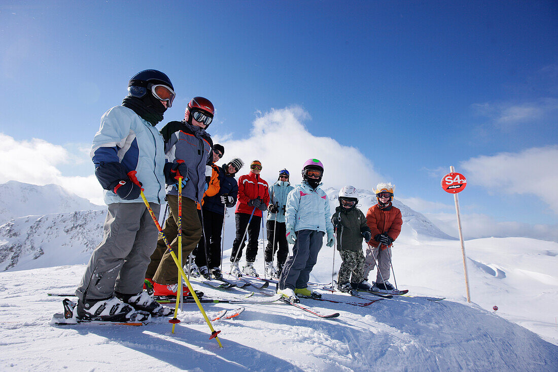 Children and adults on slope, Stuben, Arlberg, Tyrol, Austria