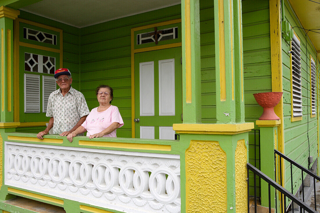 An elderly couple on their porch, San German, Puerto Rico, Carribean, America