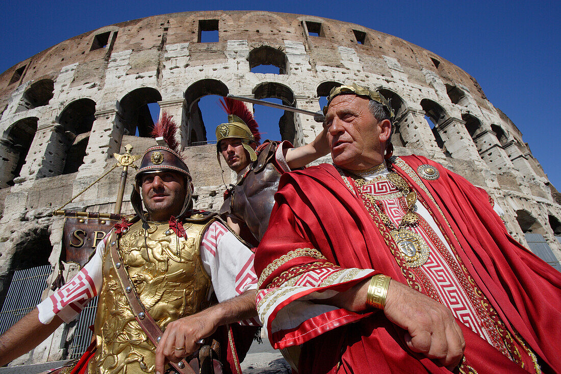 Actors in costumes in front of the colosseum, Rome, Italy, Europe