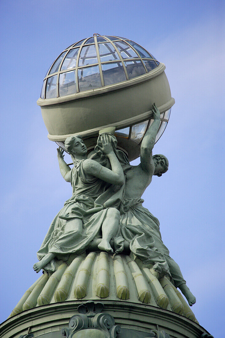 Roof decoration of a globe on the House of Books, former singer house on Nevsky Prospekt, St. Petersburg, Russia