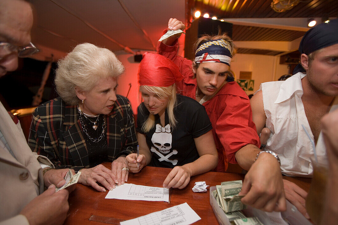 Placing bets for a Royal Clipper Crab Race, Aboard Sailing Cruiseship Royal Clipper (Star Clippers Cruises), Mediterranean Sea, near Sicily, Italy