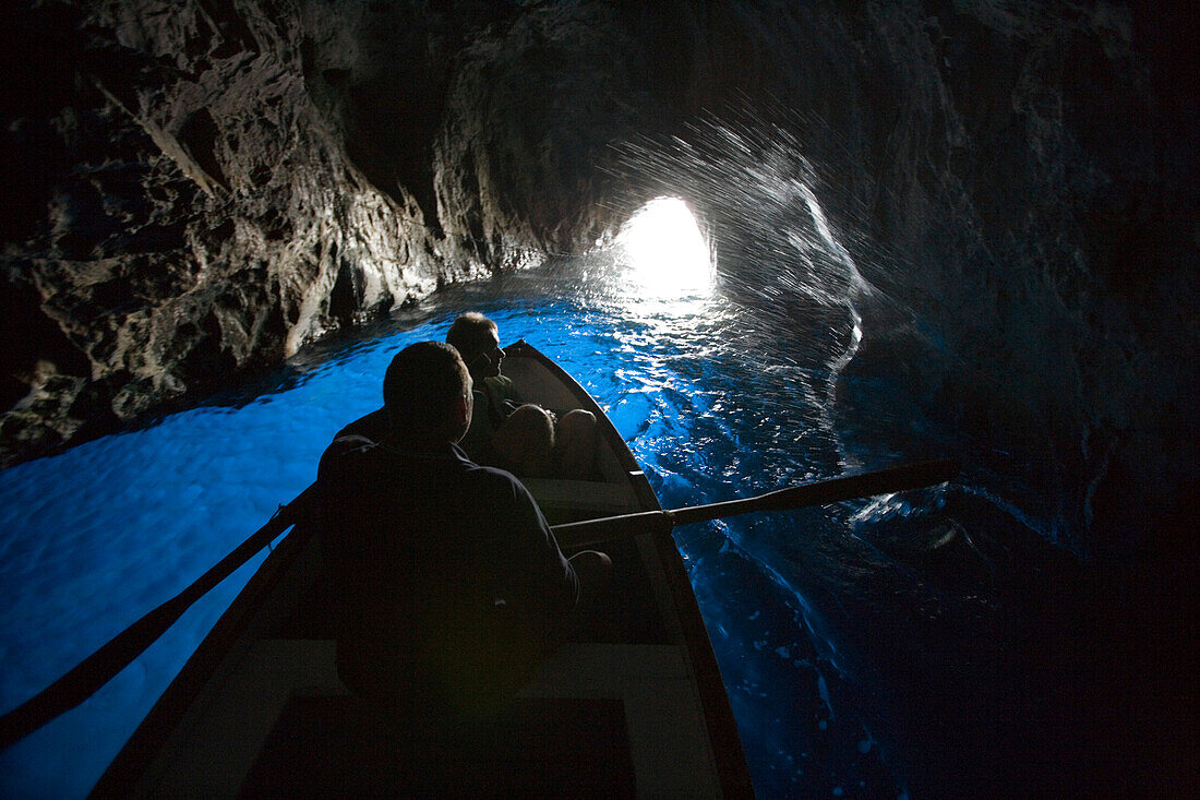 Rowing boat inside the Blue Grotto, Capri, Campania, Italy