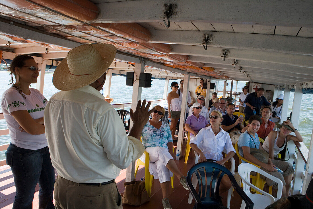 Passengers listen to lecturer aboard an Amazon River Boat, Near Santarem, Para, Brazil, South America