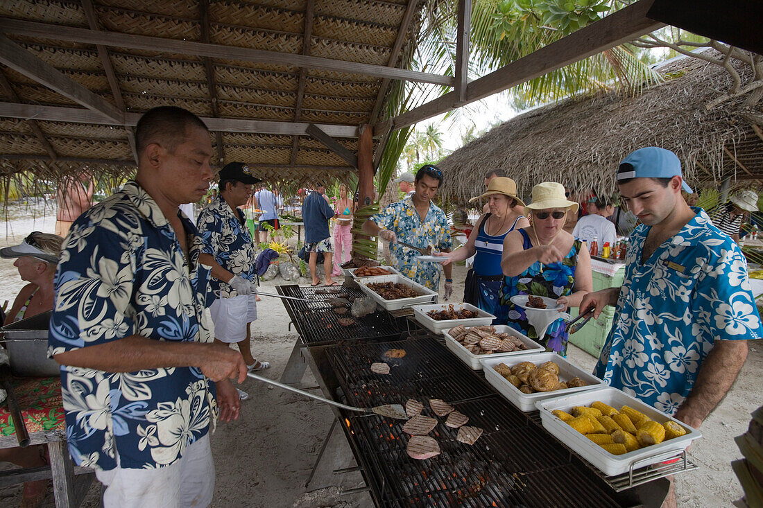 Beach barbeque lunch at a beach party for passengers of the cruiseship Star Flyer (Star Clippers Cruises), Fakarava, The Tuamotus, French Polynesia